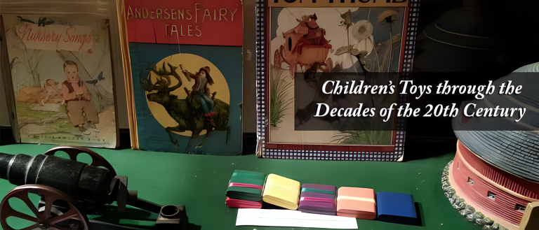 Exhibit display featuring vintage children’s toys and books titled “Children’s Toys through the Decades of the 20th Century.” Items include a toy cannon, colorful stacking blocks, and books with illustrated covers.